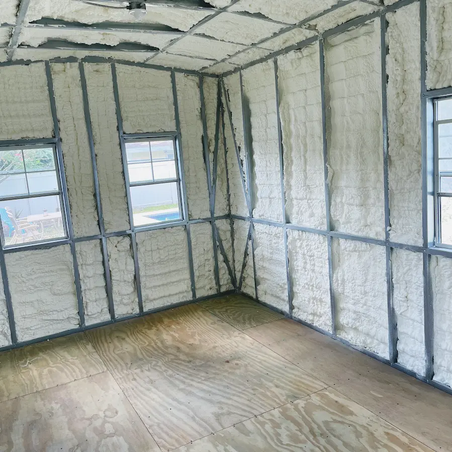 Closed-cell spray foam insulation applied to wall cavities in a residential project in Carthage